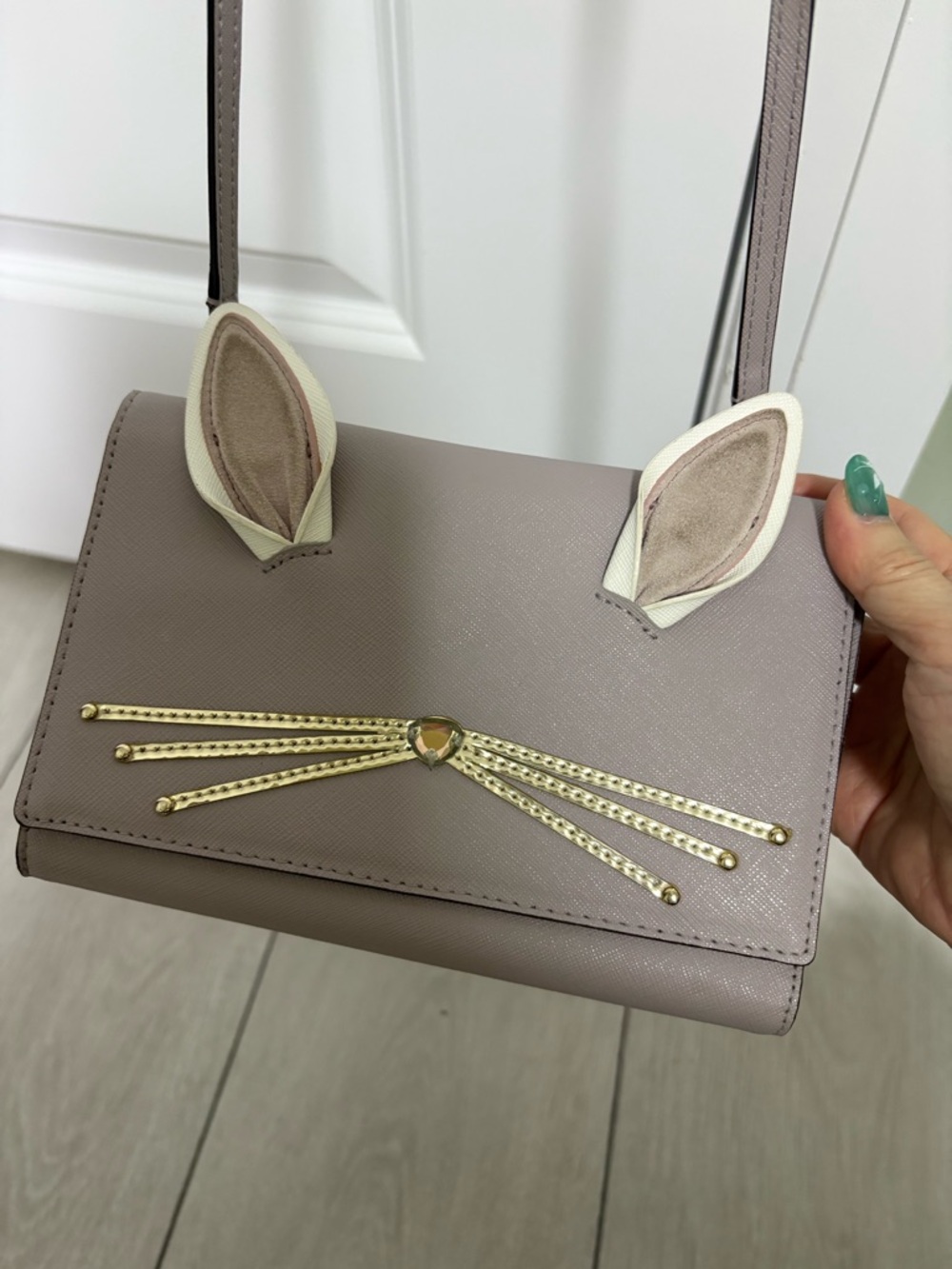 kate spade taupe Cali leather bunny crossbody with gold whisker detail